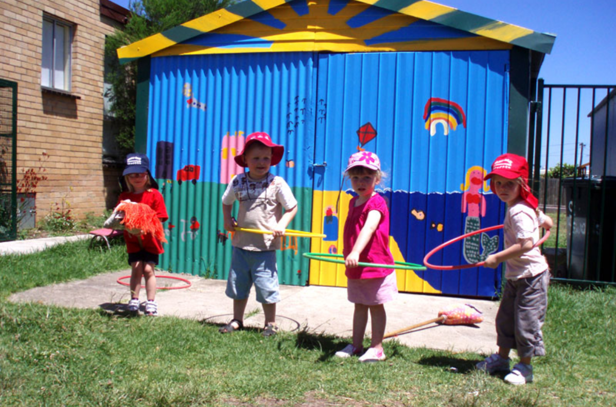 Hoola-Hooping-in-Front-of-the-Shed.png